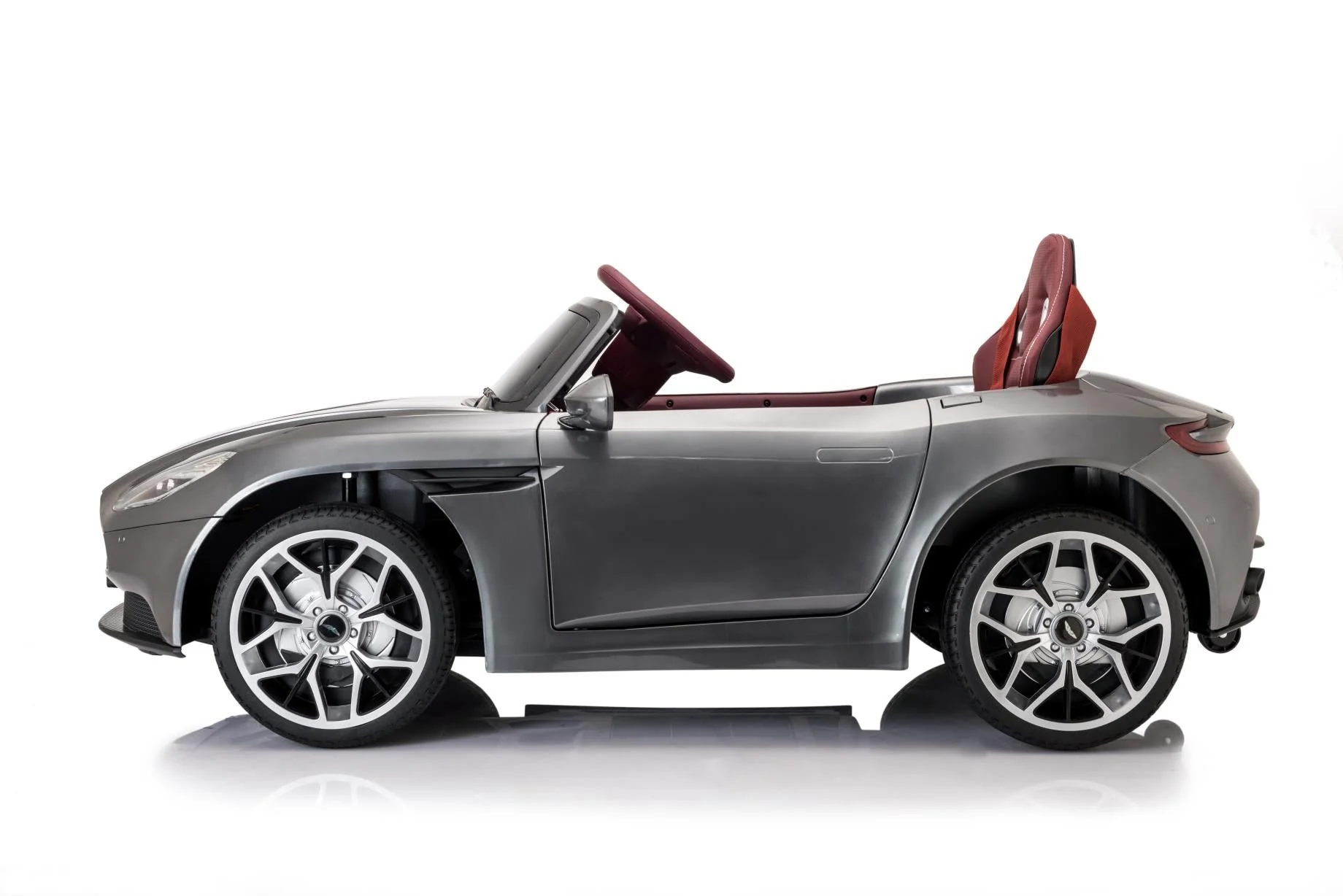 "Aston Martin DB11 grey electric ride on car for kids with parental control, isolated on white background"