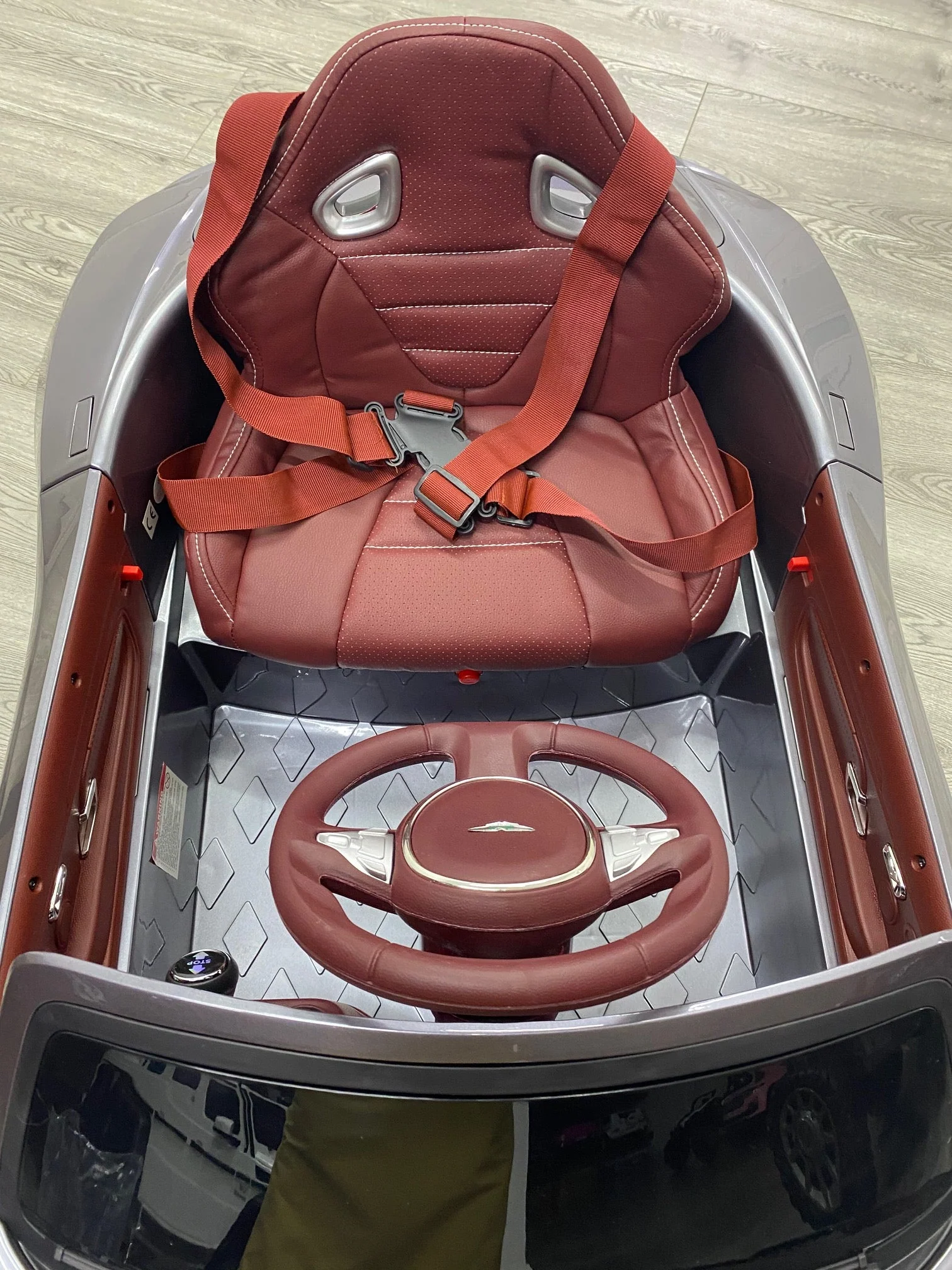 "Electric Aston Martin DB11 ride-on toy car with parental control, mini steering wheel for kids."