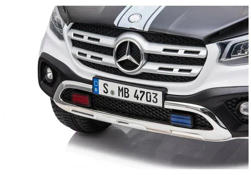 Front grille and emblem of Mercedes X Class Pick Up Truck electric ride on police car with European license plate.